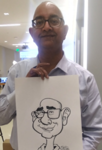 Wedding guests enjoying live caricature drawings at a los angeles wedding reception