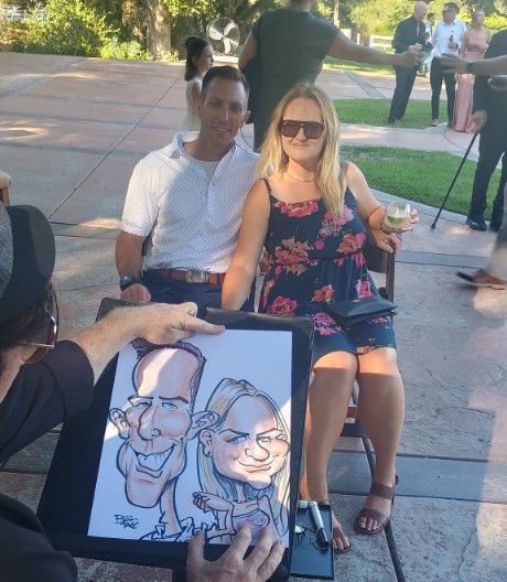 Wedding guests with their custom caricature keepsake during a live caricature event at Circle Oak Ranch in Fallbrook